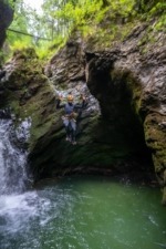 Canyoning Guide Jumping Into Emerald Pool