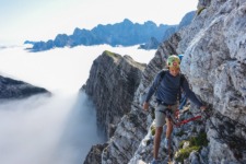 Climbing above clouds in Mojstrovka at the heart of Julian Alps