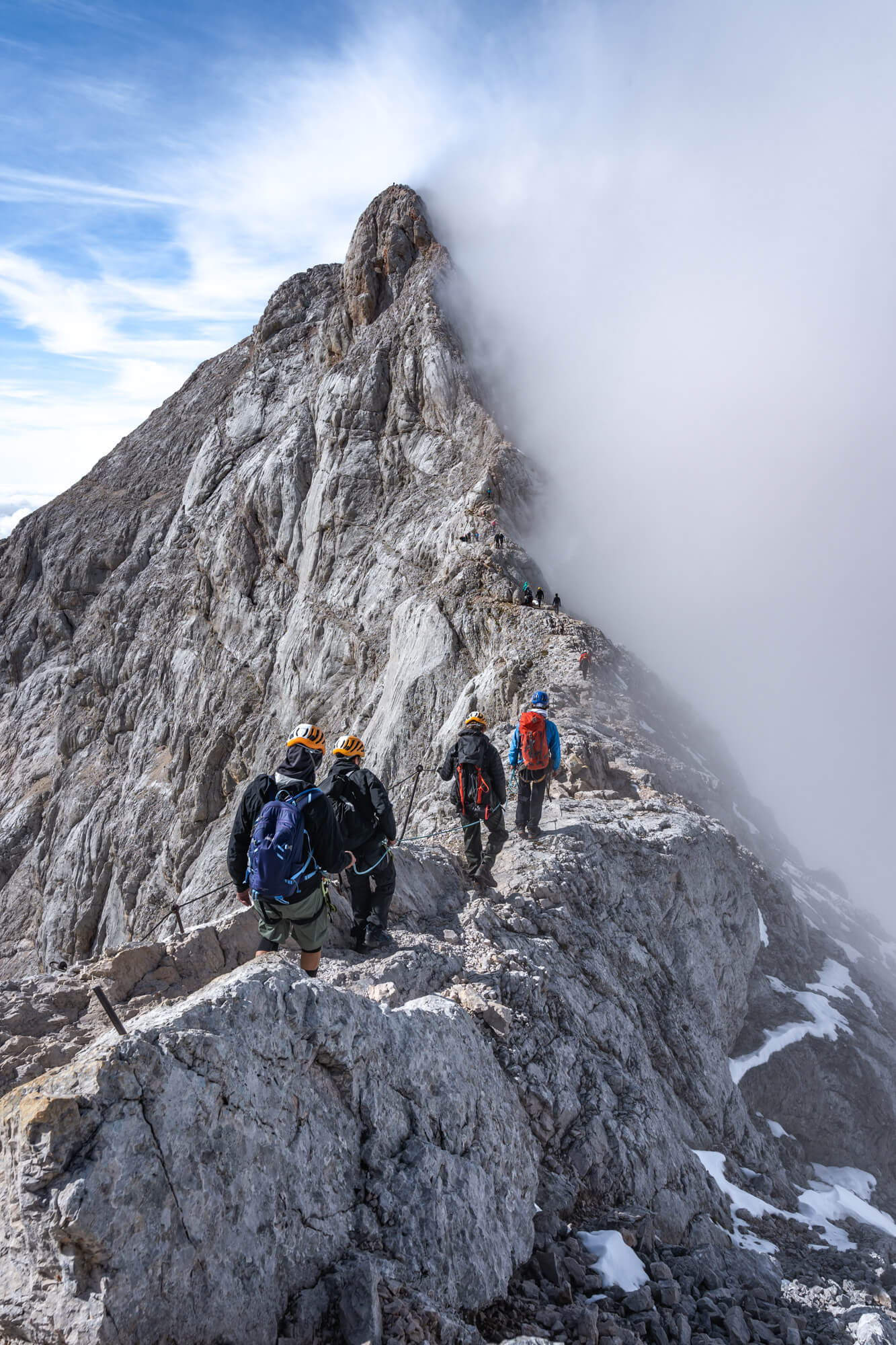 Climbers on the Misty Ridge on Triglav Mountian Climbers on the Misty Ridge on Triglav Mountian