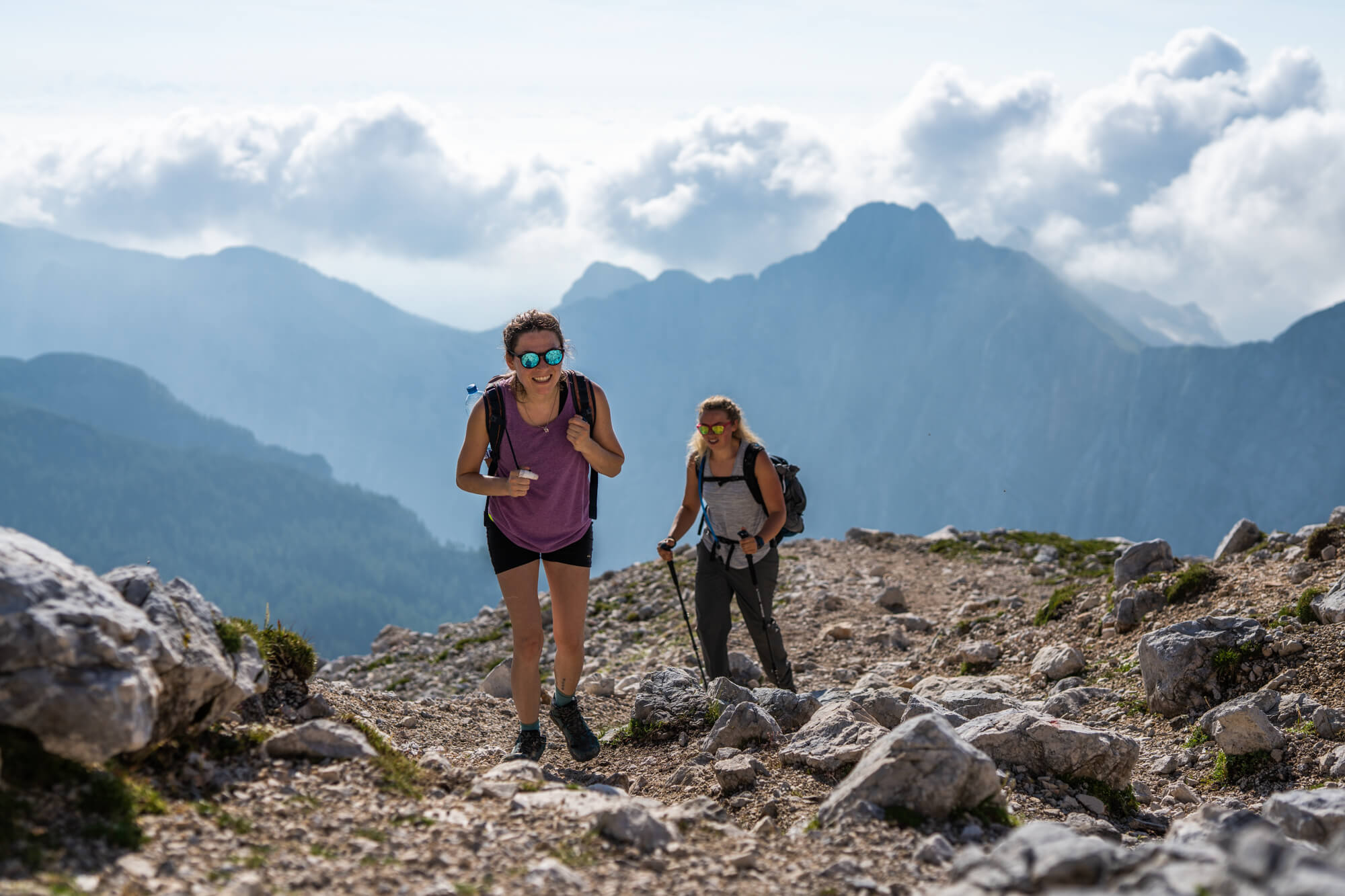 Happy Female Hikers on the Path Towards Kredarica Hut Happy Female Hikers on the Path Towards Kredarica Hut