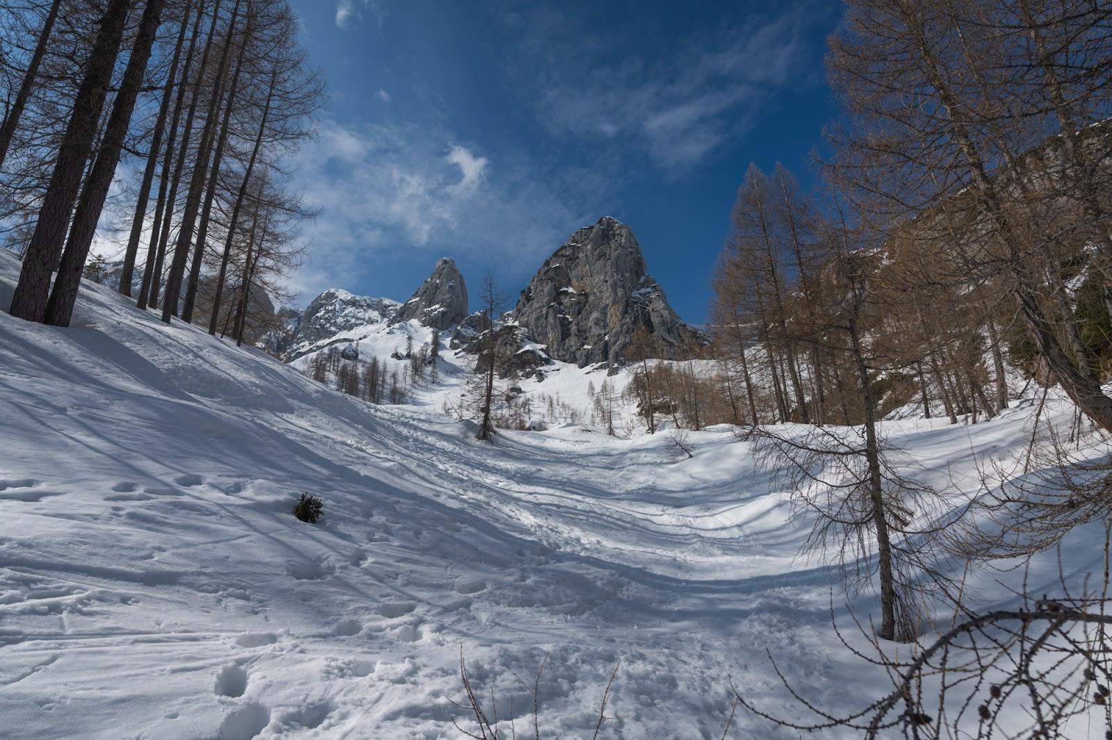 Hiking Triglav in winter time, mountain Kurica on the background