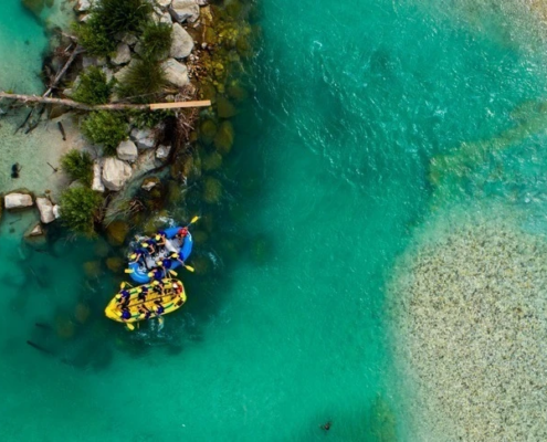 Aerial image of a pontoons on a crystal blue waters of river Soca