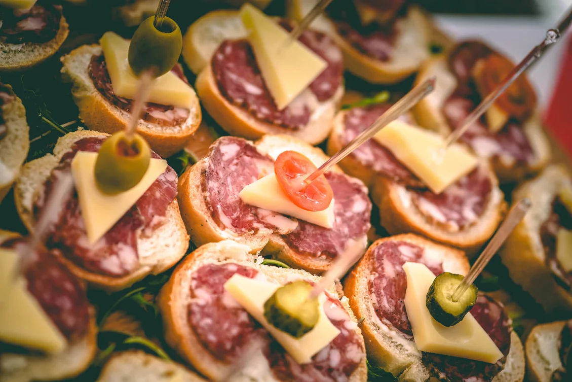 Slovenian Salami on a slices of bread with cheese and vegetables